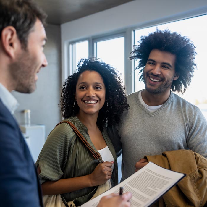 couple talking to loan officer