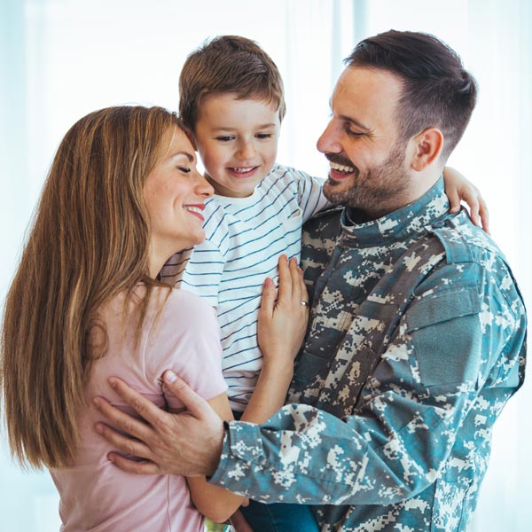 military man with smiling family
