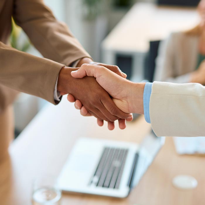 Business people shaking hands during a meeting in the office